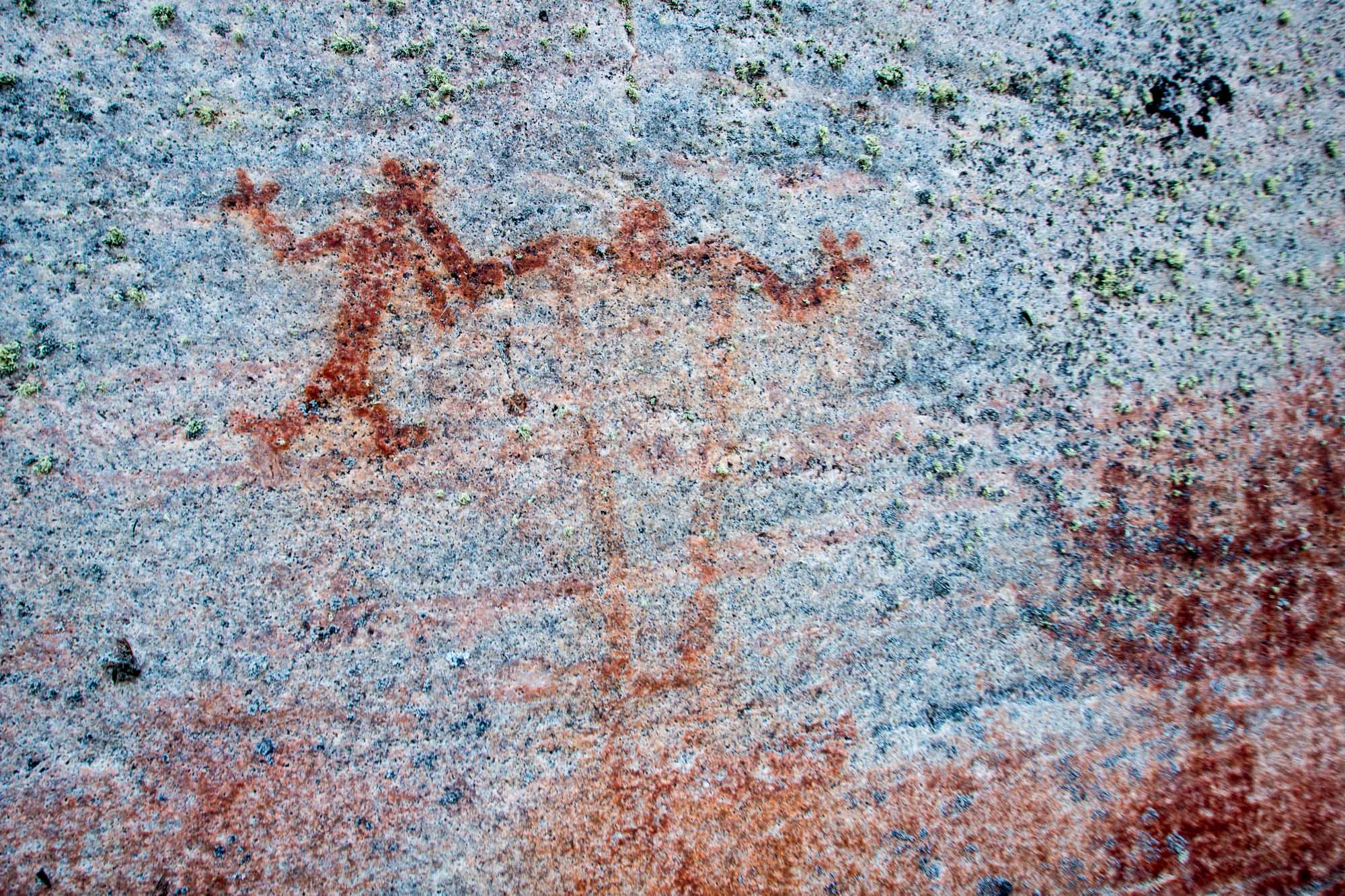 shaman holding infant or medicine bag
